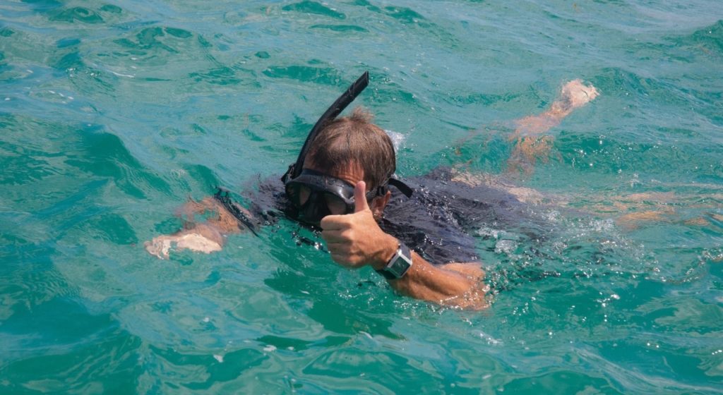 boy snorkeling in rote island
